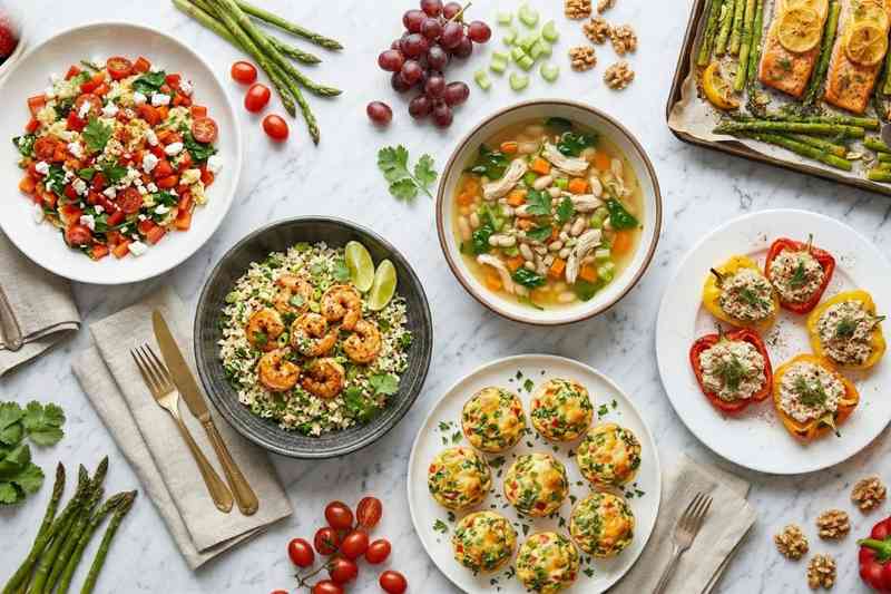 High protein low calorie meals flat lay with 6 different recipes on marble surface