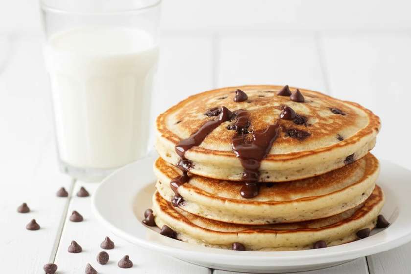 Chocolate chip banana pancakes with melting chocolate chips for kids breakfast