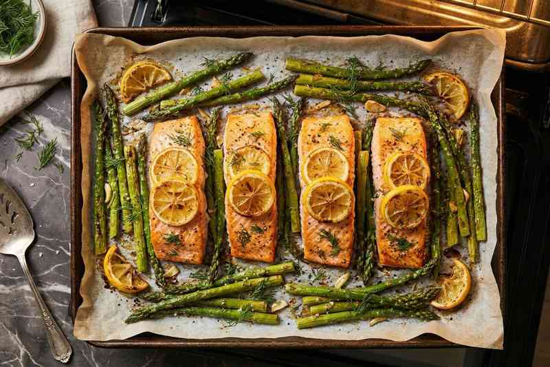 High protein low calorie meal salmon and asparagus sheet pan with lemon