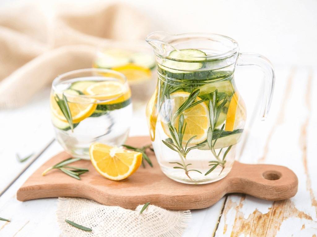 Detox drink with lemon, cucumber, and rosemary in a glass jar – perfect for hydration and cleansing.