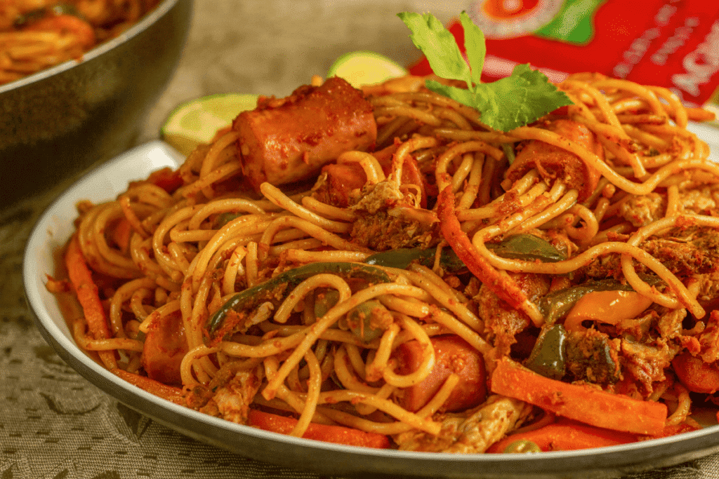 Easy vegan dinner pasta primavera made with tomato sauce, fresh herbs, and mixed vegetables in a bowl