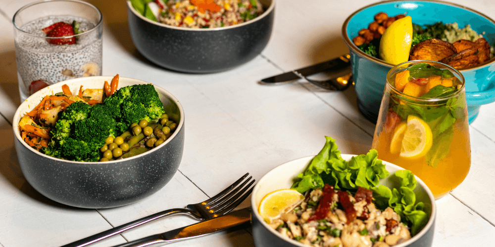 1 (12) Healthy plant-based meal with a variety of colorful vegetables and grains served in a bowl, perfect for a balanced diet.