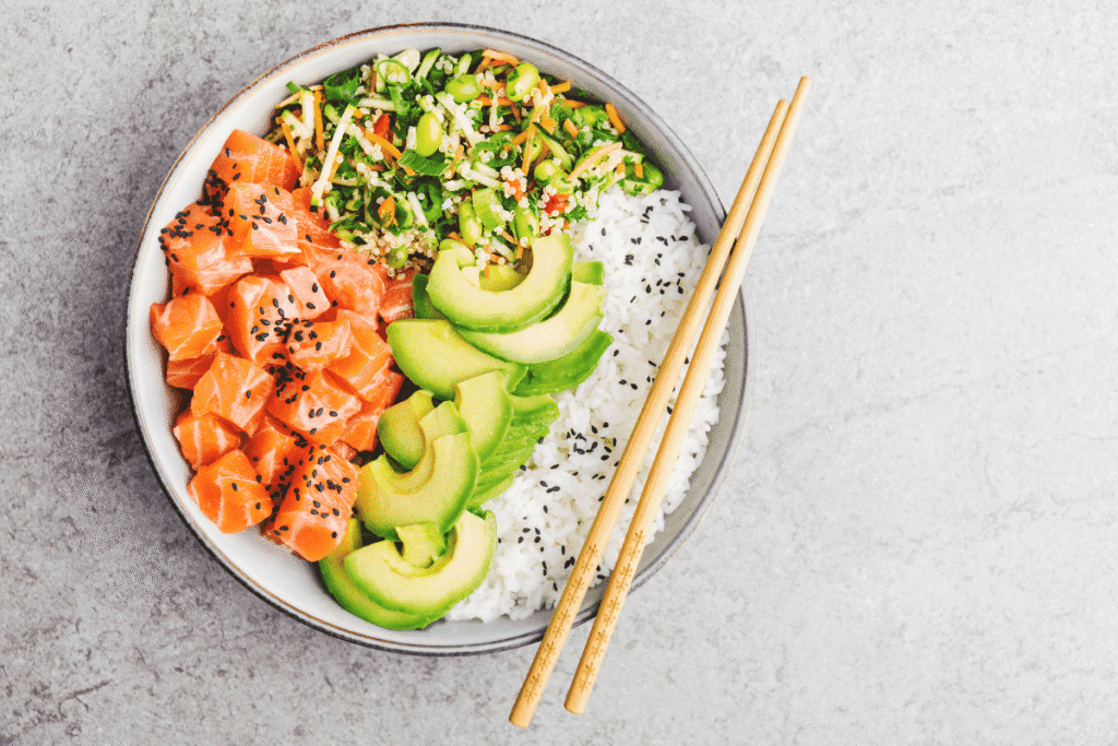 Colorful high-protein breakfast bowl with salmon, avocado, quinoa, and veggies – healthy and energizing morning meal