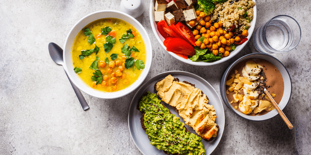 2 (17) Healthy and colorful variety of plant-based meals in bowls, including grains, vegetables, and sauces.