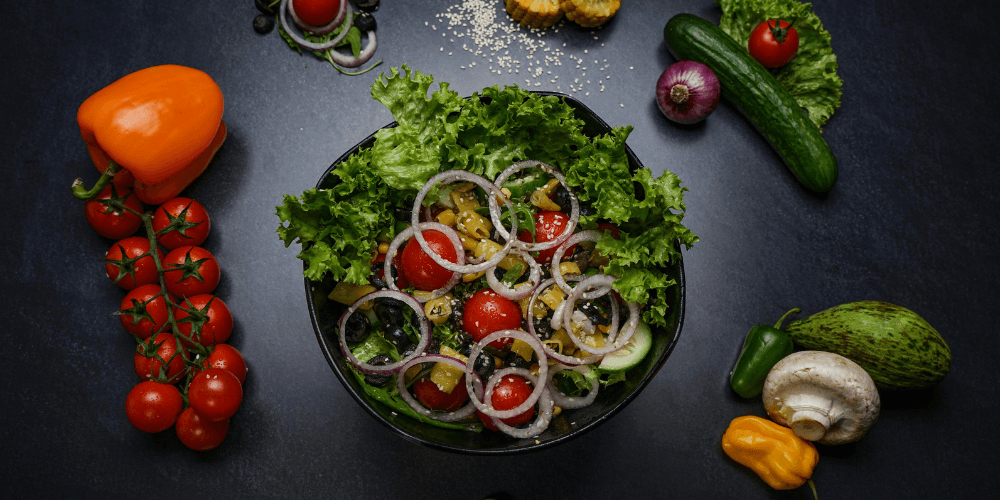 A beautifully arranged plate with vibrant vegetables, grains, and plant-based proteins, creating a balanced and colorful vegan meal.