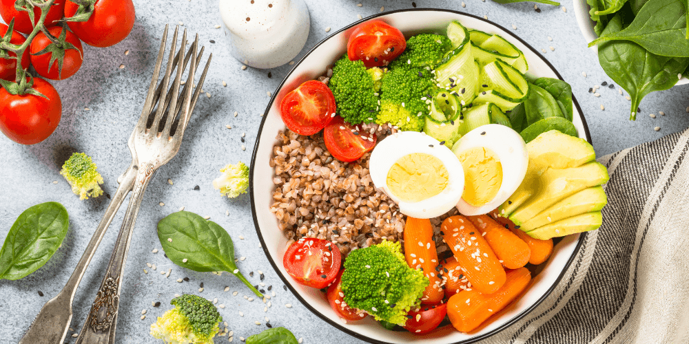 A fresh and vibrant salad with a mix of tomatoes, cucumbers, and herbs, served in a bowl with a refreshing dressing.