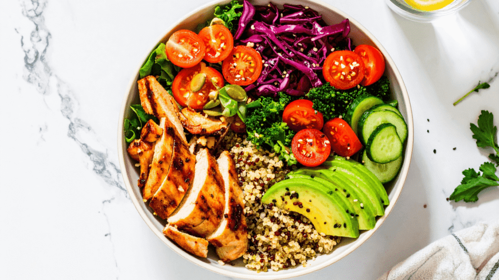Low calorie high protein meals with chicken, avocado, quinoa, and fresh vegetables