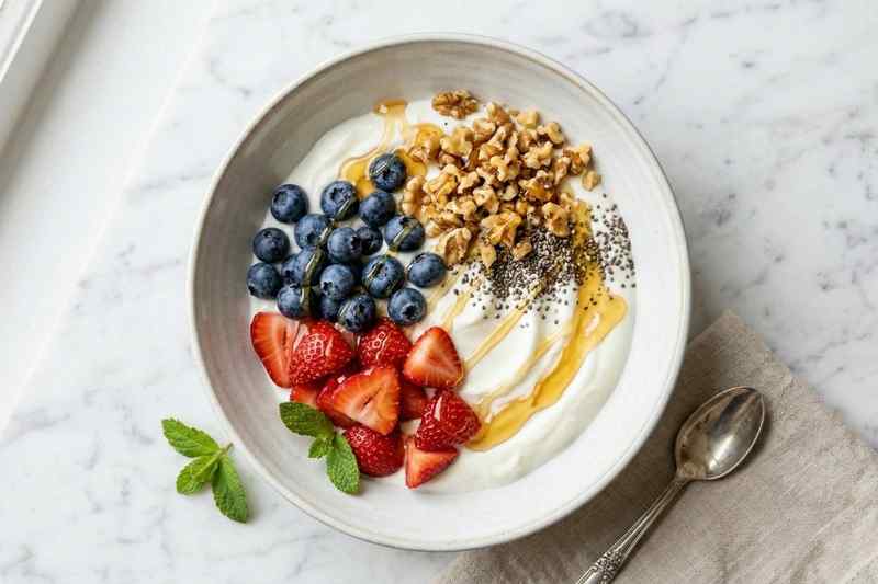 Greek yogurt energy bowl with berries and walnuts