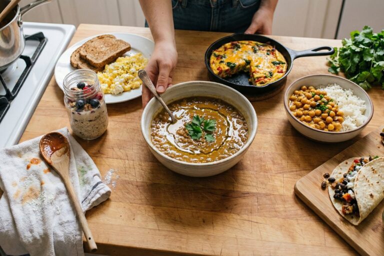 Twenty cheap healthy meals under $2 per serving on kitchen counter for budget meal planning