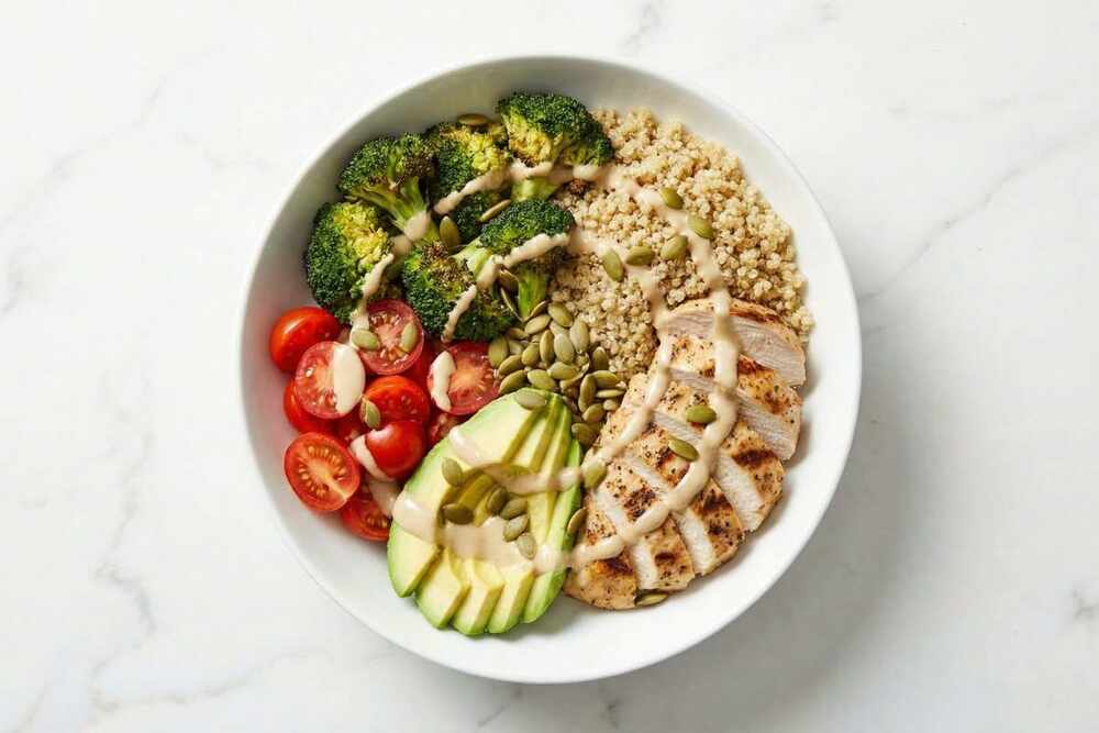 High protein chicken quinoa power bowl with roasted vegetables
