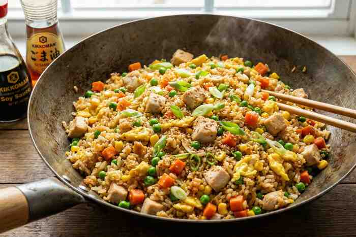 High-protein chicken fried rice with eggs and vegetables, quick Asian dinner