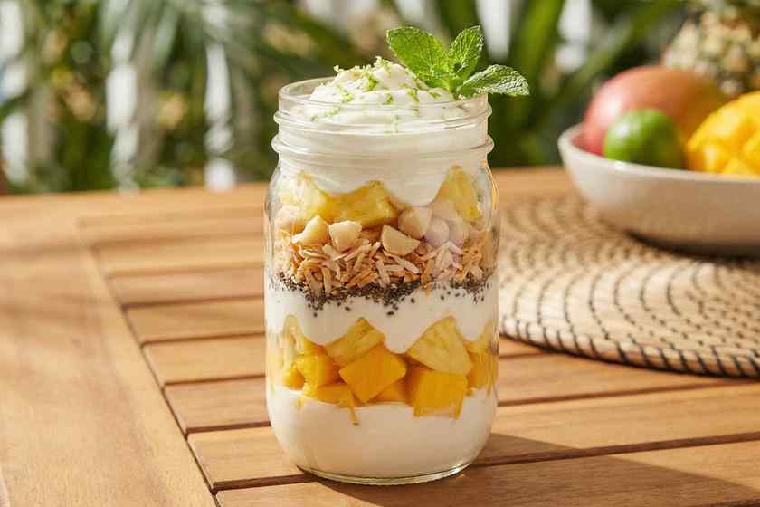 Tropical mango protein parfait with pineapple coconut macadamia nuts high protein breakfast 30g