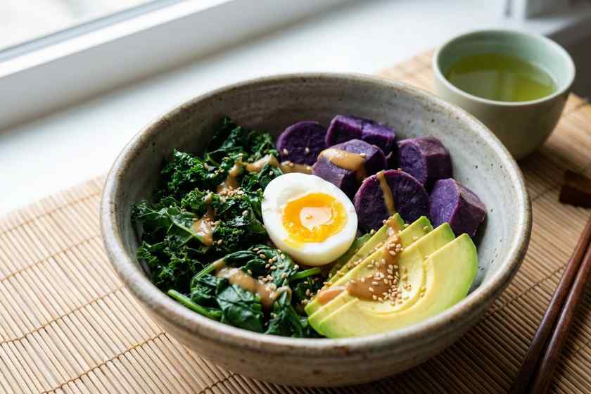 Blue zone breakfast bowl with purple sweet potato greens miso egg longevity diet Okinawan centenarian meal