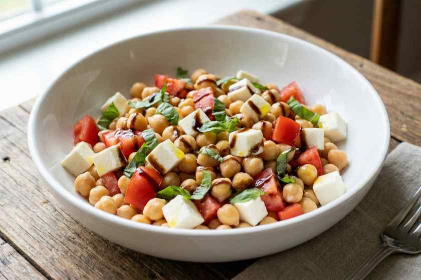 Caprese chickpea salad with fresh mozzarella, tomatoes, basil, and balsamic glaze for no cook lunch